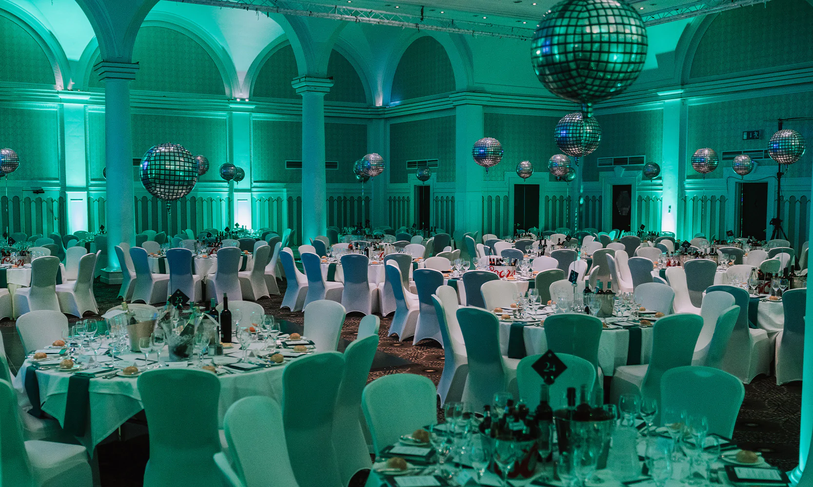 Room for corporate event featuring custom balloons and branding.