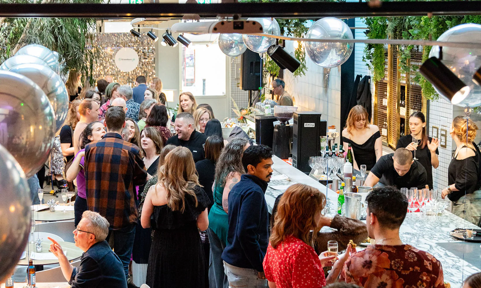 Guests enjoying food at an event.