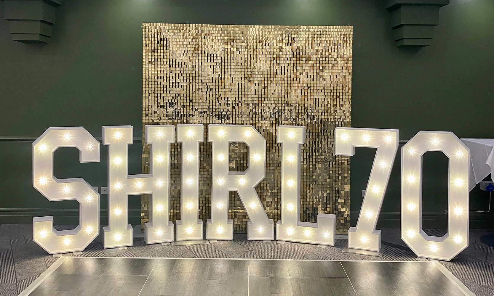 White Light-Up Letters with Gold Sequin Wall for hire from Elizabeth James Events
