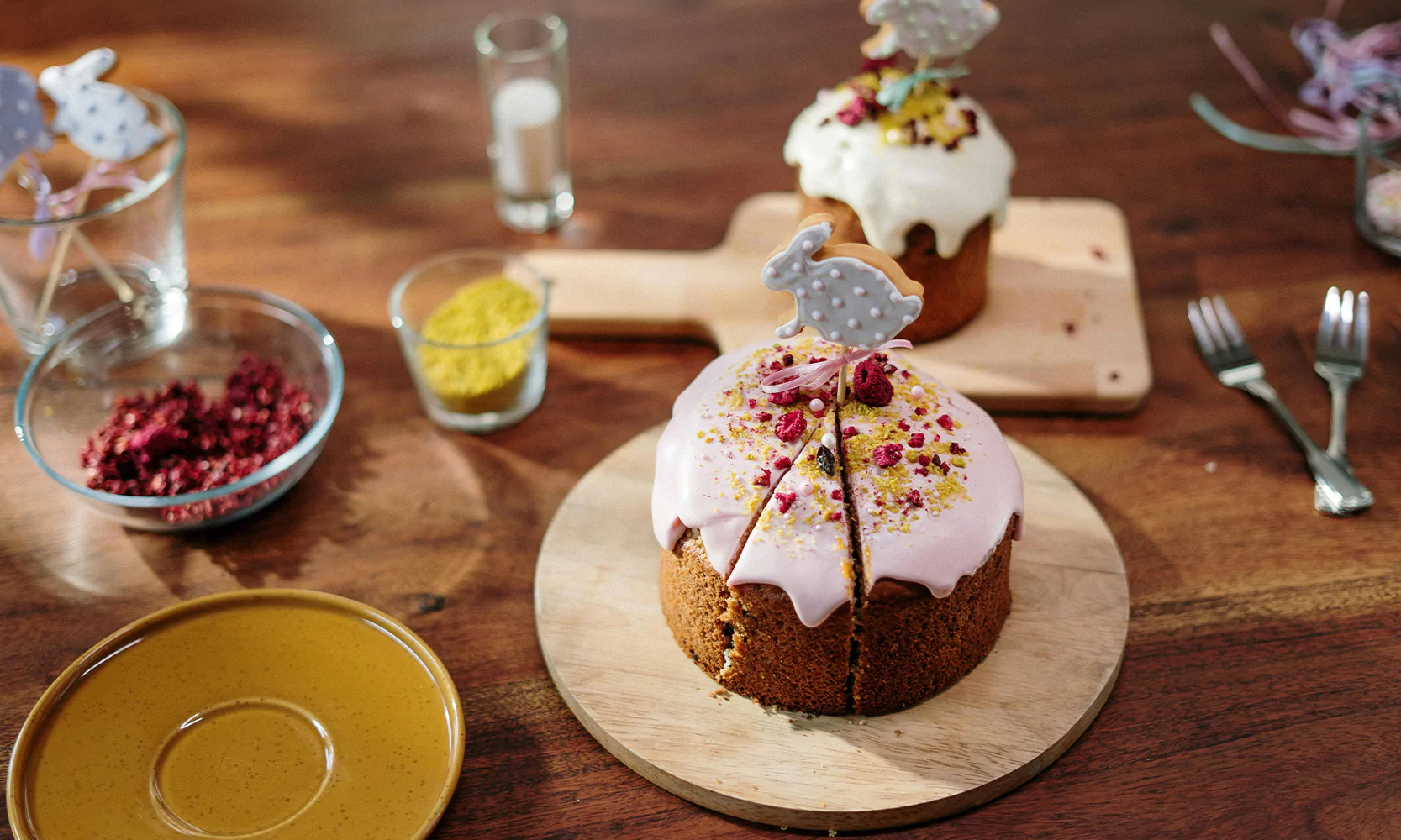 Decorated Easter cake with bunny topper served on a wooden board for a spring celebration