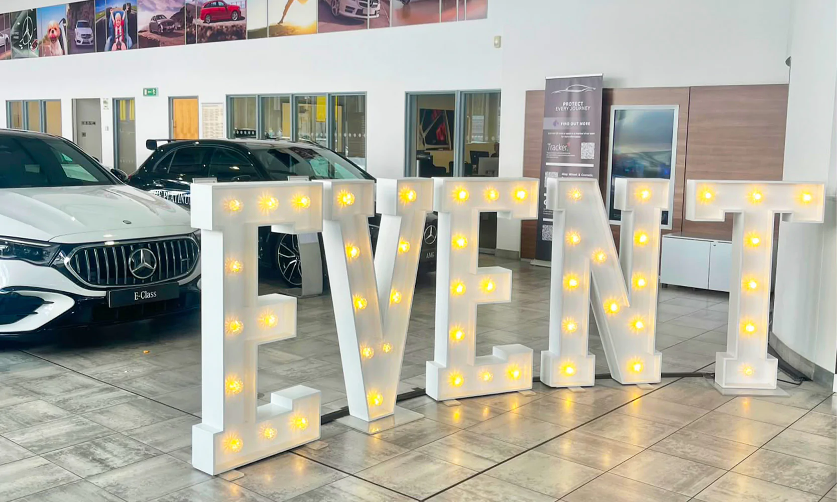 Light-up letters on display at a corporate event.