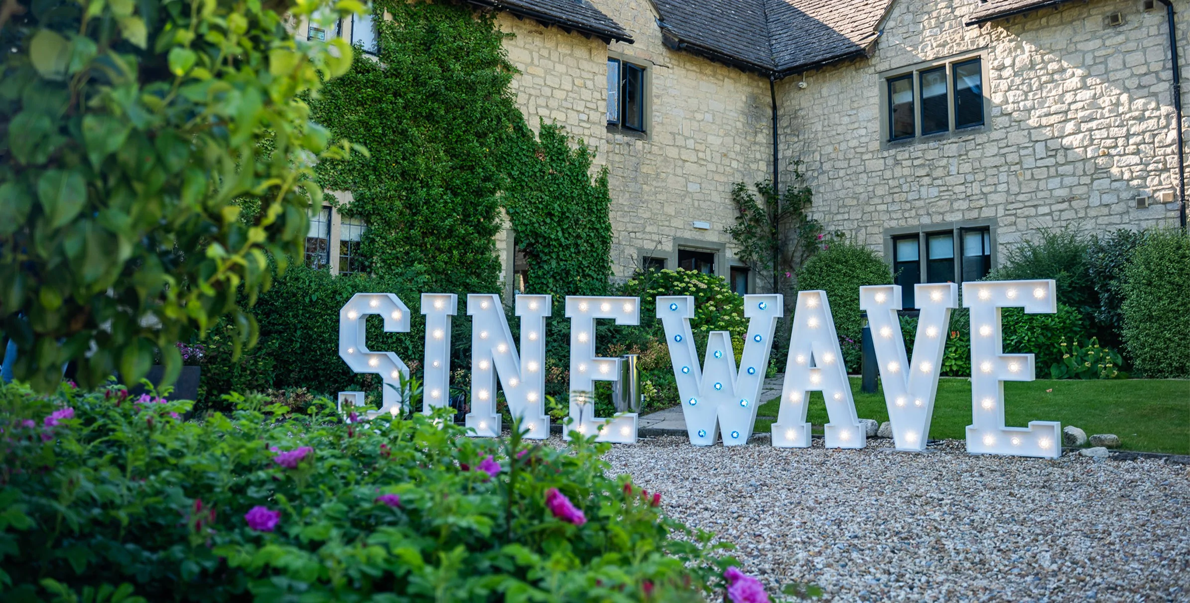 White Corporate Branding Light-Up Letters for hire from Elizabeth James Events